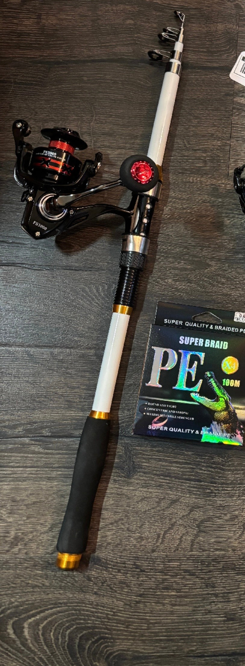 White 6 foot telescoping rod and reel with line